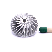 3D printed micro turbine impeller next to a match